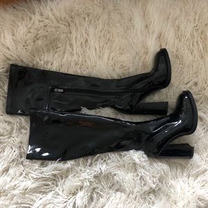 Patent leather knee high heeled boots